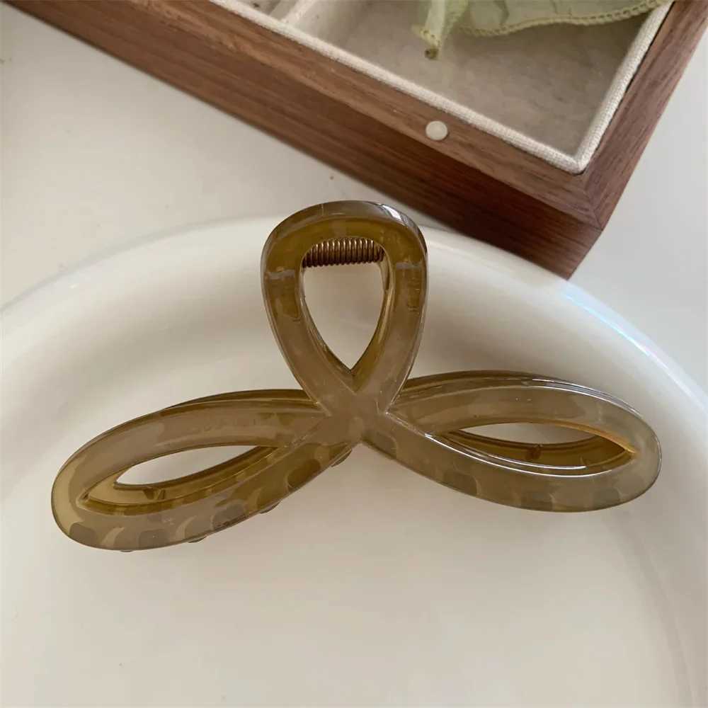 Elegant bow shark clip fashionable back of the head hair clip retro ponytail fixed female hair clip simple hollow geometric hair clipT250425