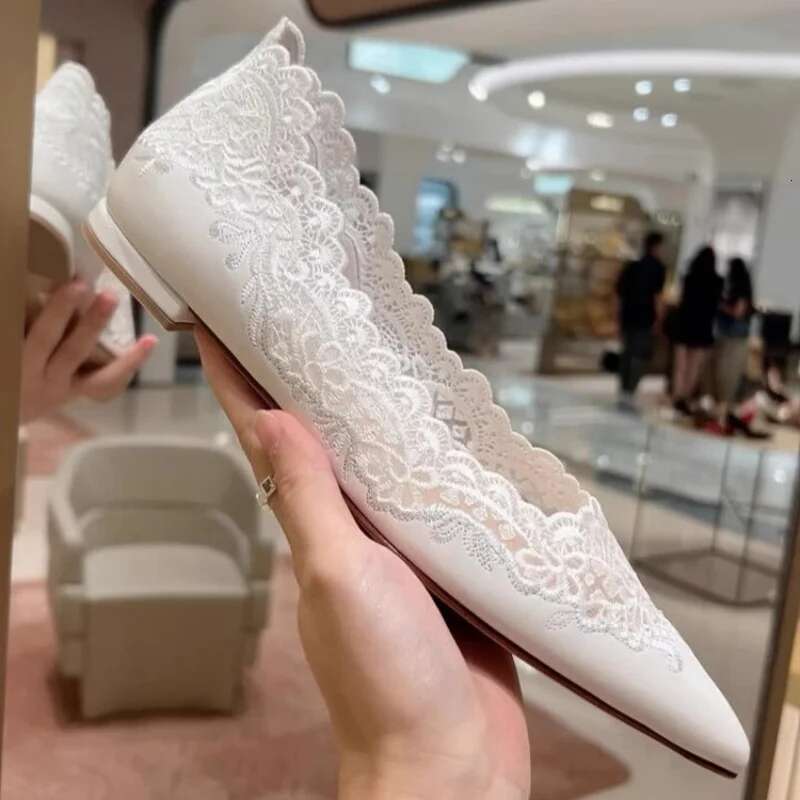 Spring and summer new pointed shallow lace hollow soft sole white wedding banquet dress versatile flat women's shoes