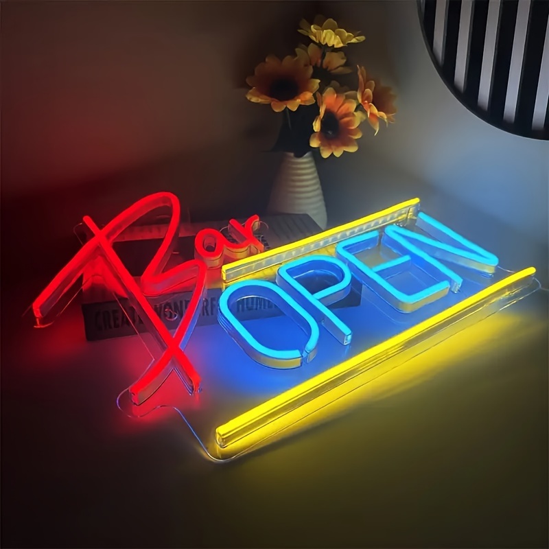 Open Door Neon Sign. Dimmable LED, bright and highly visible "We're Open" neon sign. Equipped with an on/off switch. Suitable for comme