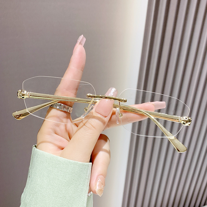 Classic Designer Sunglasses for women Metal Frameless Oval Sunglasses Rimless Metal Frame Diamond Shape Fashion Small Frame Shades Ins Eyeglasses Vint