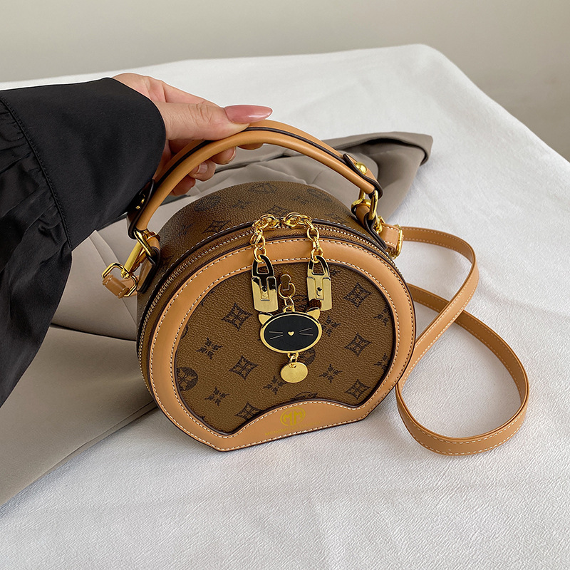 2025 New Arrival Elegant Women's Round Bag Fashion Versatile Crossbody Shoulder Bag Stylish Party bag hot sale Yellowish-brown coffee Off-white