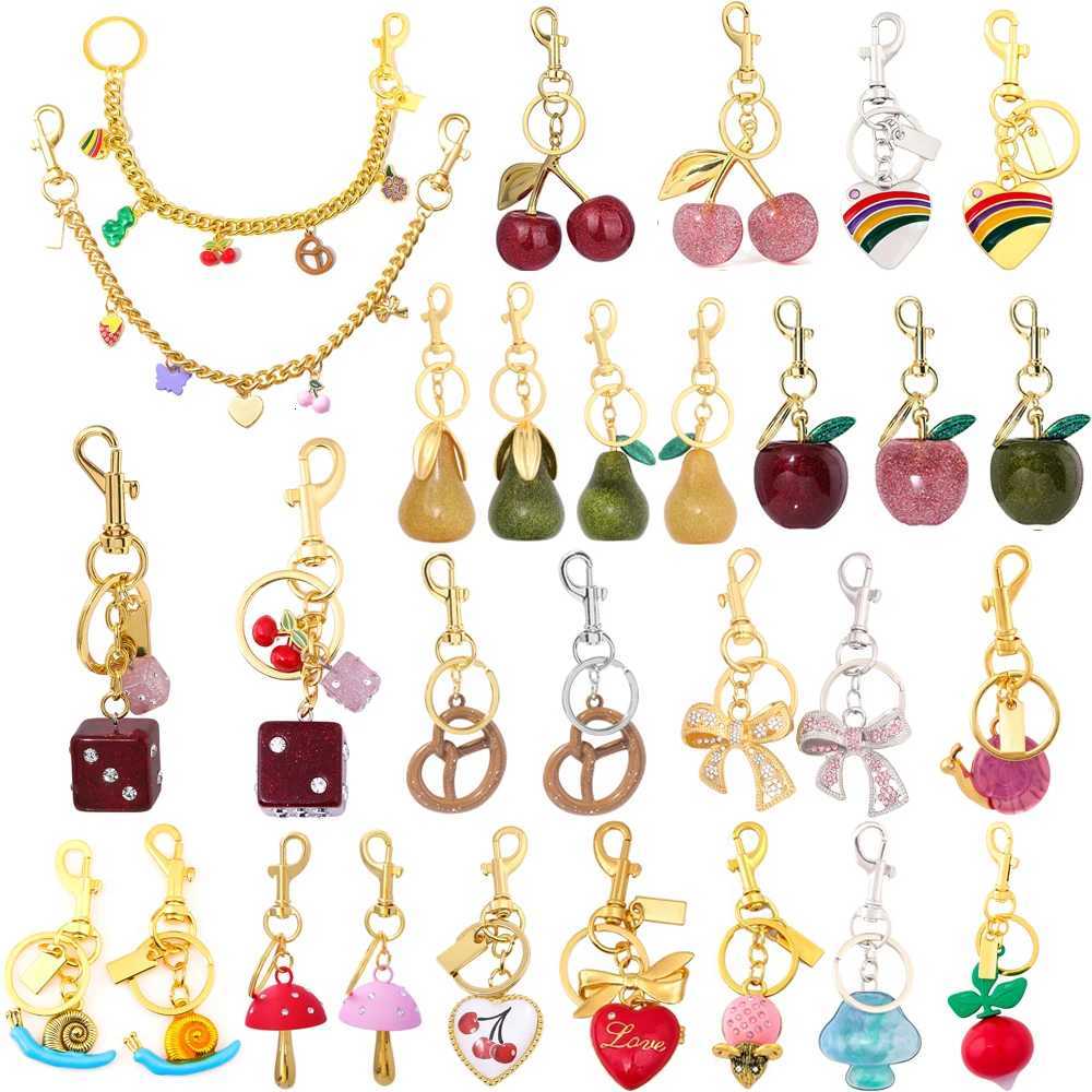 Sparkling Cherry Strawberry Apple Pear Bag Charm Keychain Bow Pretzel Dice Bag Pendant Car Key Chains Jewelry Decoration GiftT251127