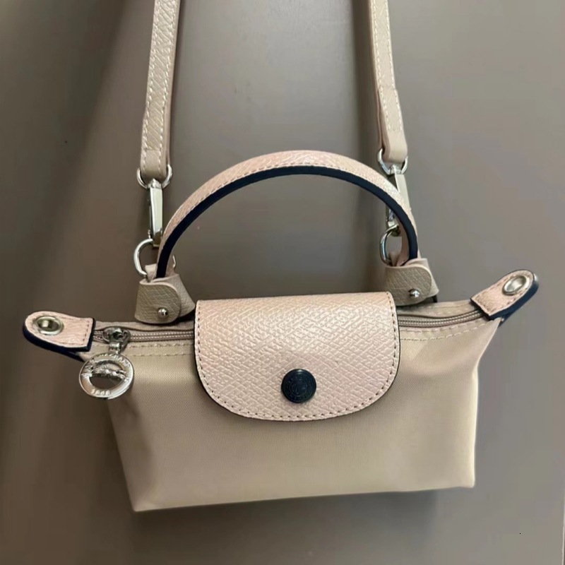Designer 2025S women dragon dumpling new mini short handle handbag shoulder crossbody mobile phone change makeup bag