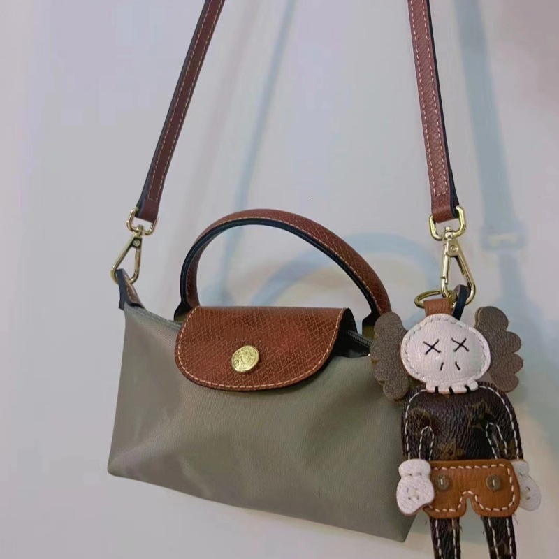Designer 2025S women dragon dumpling new mini short handle handbag shoulder crossbody mobile phone change makeup bag