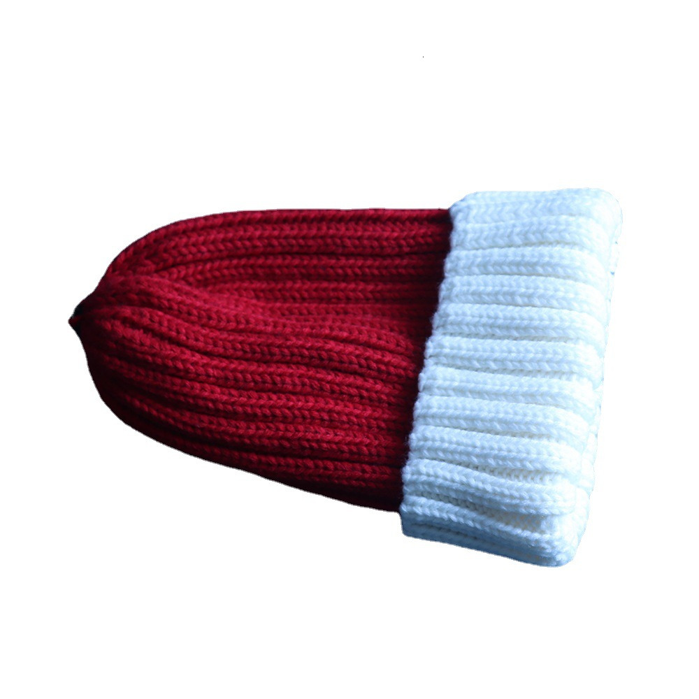 Knitted two-color woolen hat for autumn and winter warmth, rolled edge hat, Korean version two-color women's raccoon ball knitted hat