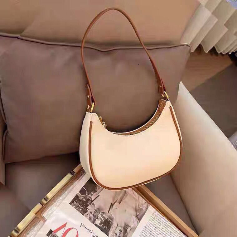 Free shipping 2025 new designer women's underarm bag, single shoulder, handheld, niche design, crescent shaped women's bag, high top