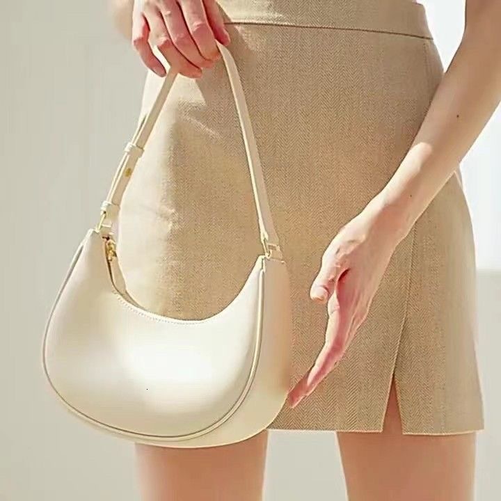 Free shipping 2025 new designer women's underarm bag, single shoulder, handheld, niche design, crescent shaped women's bag, high top