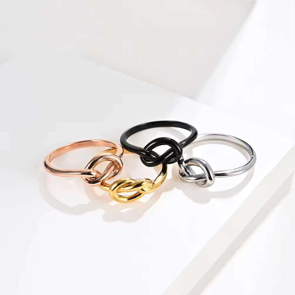 DHCollections Stainless Steel Knot Shape Rings Titanium Steel Love Knot Adjustable Rings Fashion Jewellery for Women and Men