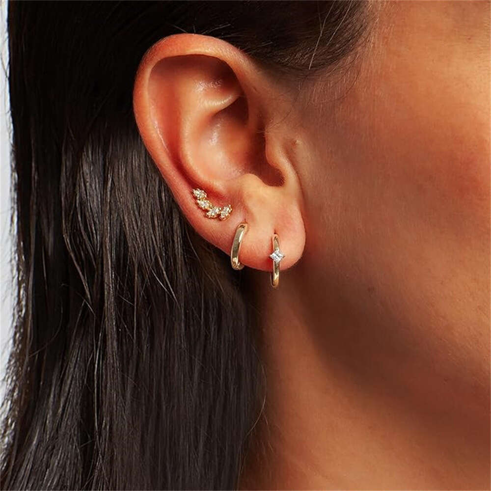 chic unisex jewelry collection featuring golden copper accents matching hoop earspools finger ornaments