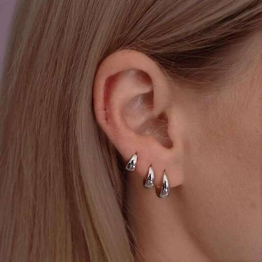 chic unisex jewelry collection featuring golden copper accents matching hoop earspools finger ornaments