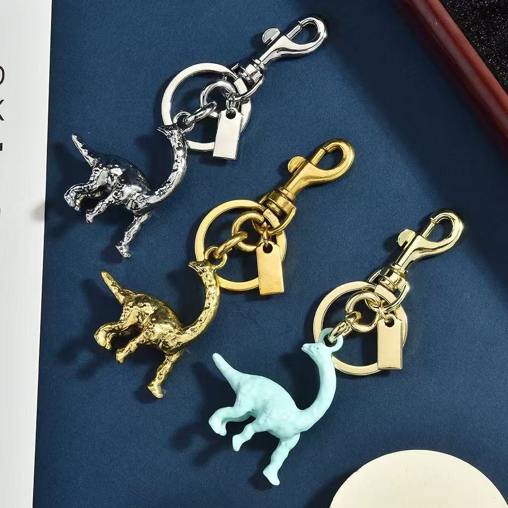 Keychains Lanyards Designer bag charm dinosaur charm Keychain Small carriage and cherry Keyring Hangings key chain women Lanyards Keychains handbga bracelet