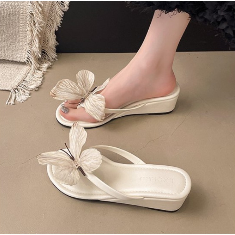 Summer New Three-dimensional Bow Flat Bottom Slope Heel Flip-flops Women's Fashion Beach Vacation Sandals
