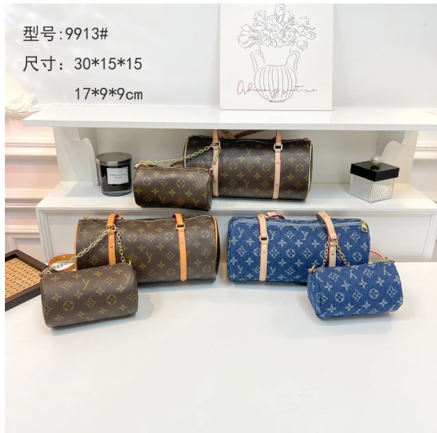 Fashionable Printed Barrel Handbags Brown monogram blue denim prints Matching small pouches functional for daily must - haves Elevate your fashion game