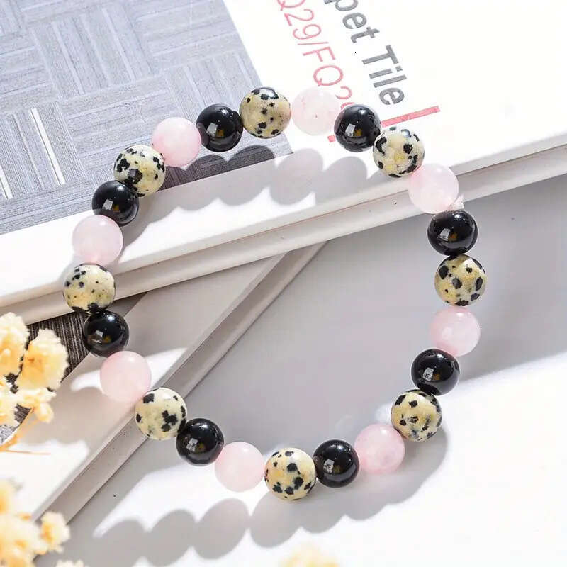 Temu Xiyin's new pink speckled obsidian bead bracelet with map and white string, let go