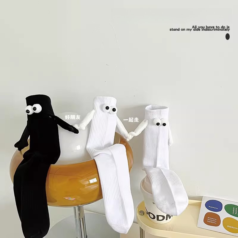Couple holding hands Tiktok net red magnetic suction stereo eye tube socks cotton personality funny black and white stockings