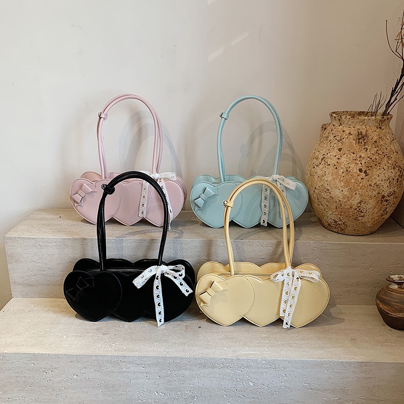 Love Sweet Chic: Unique Bow Accented Shoulder Tote for Everyday Use