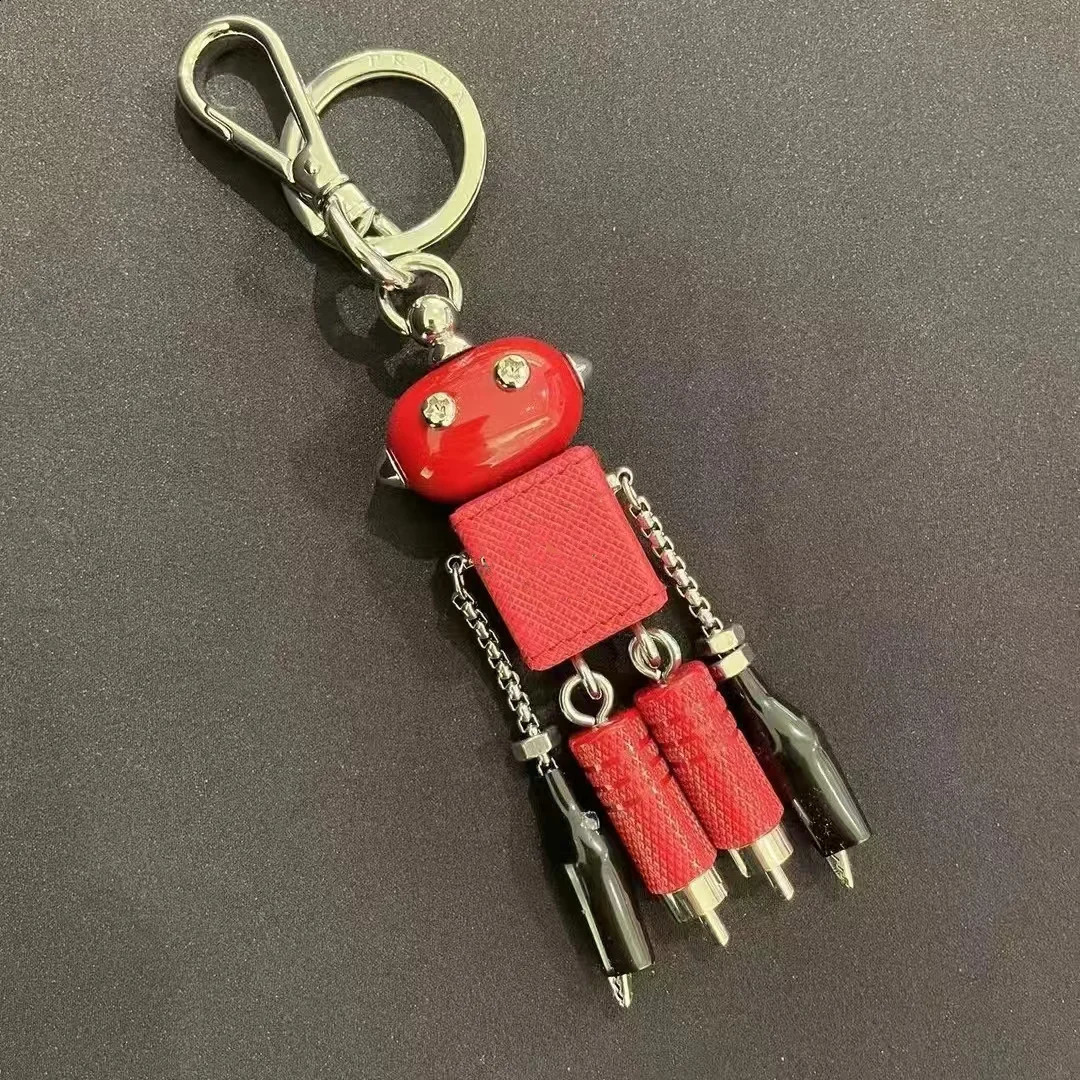 Robot pendant keychain leather bag hanging paired with artifact enamel triangle emblem hanging decoration250114