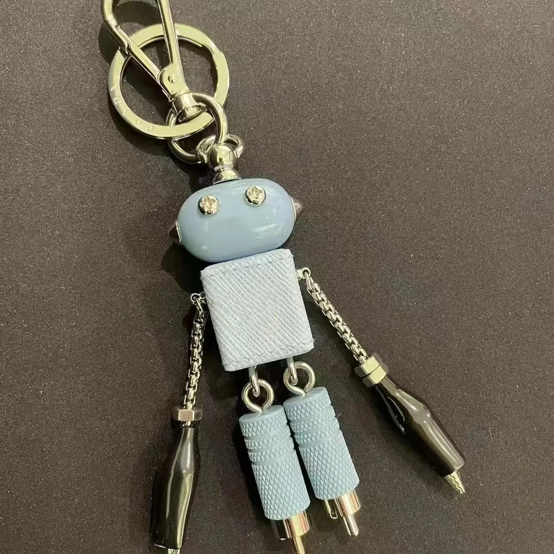 Robot pendant keychain leather bag hanging paired with artifact enamel triangle emblem hanging decoration250114