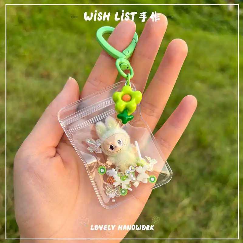 New Erchuang plush mini Labubu crushed stone vinyl cute particles baby walking bag mobile pendant cute keychain gift M250419