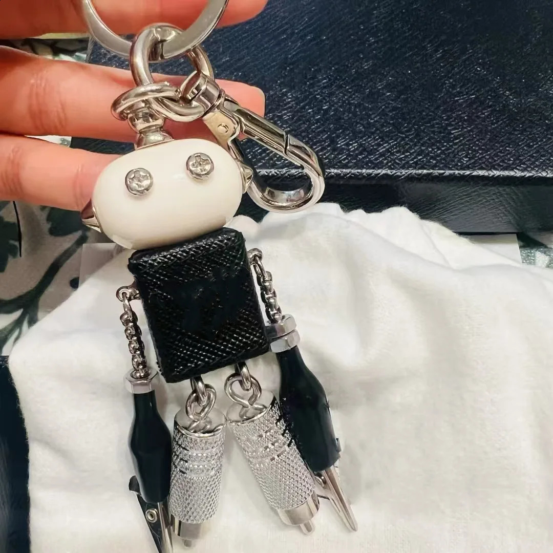 Robot pendant keychain leather bag hanging paired with artifact enamel triangle emblem hanging decoration250114