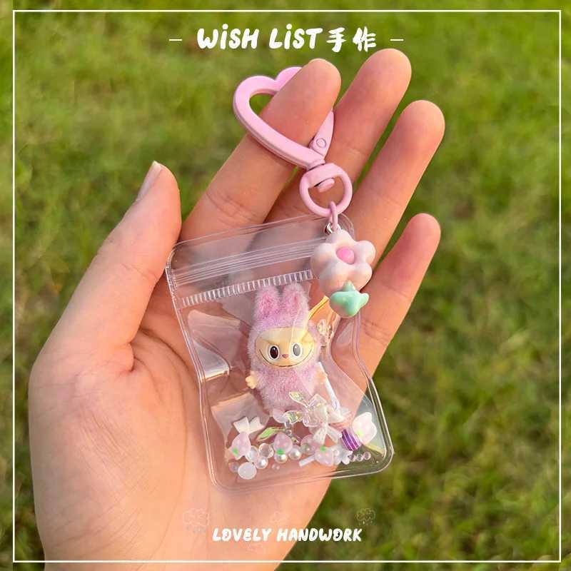 New Erchuang plush mini Labubu crushed stone vinyl cute particles baby walking bag mobile pendant cute keychain gift M250419