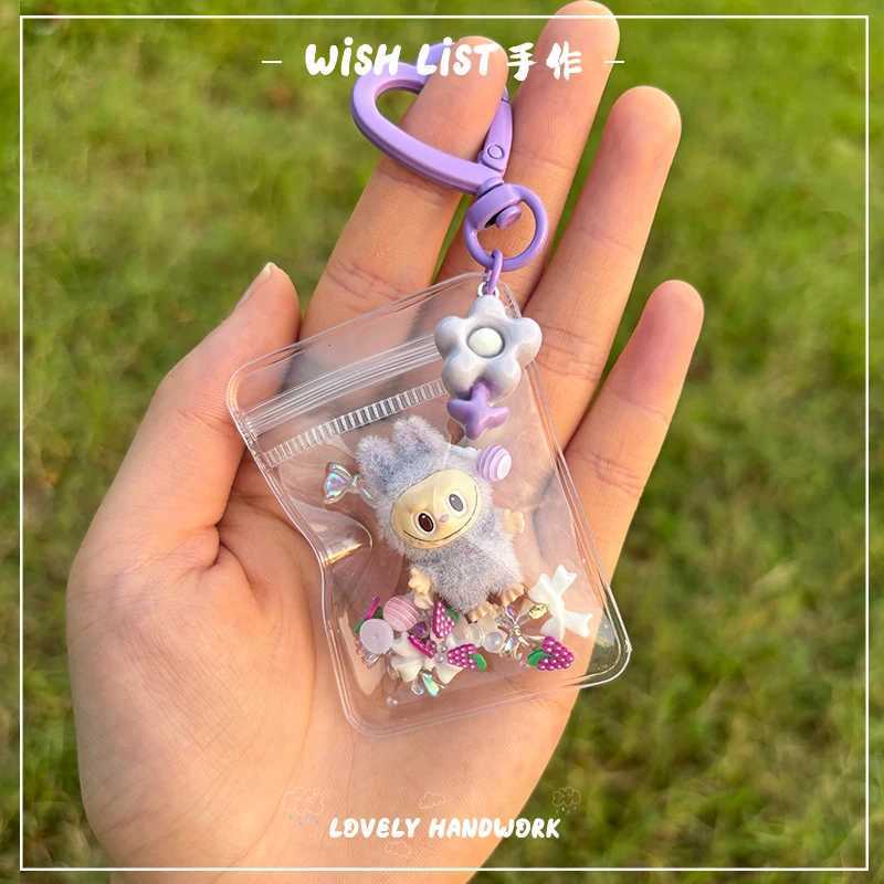 New Erchuang plush mini Labubu crushed stone vinyl cute particles baby walking bag mobile pendant cute keychain gift M250419