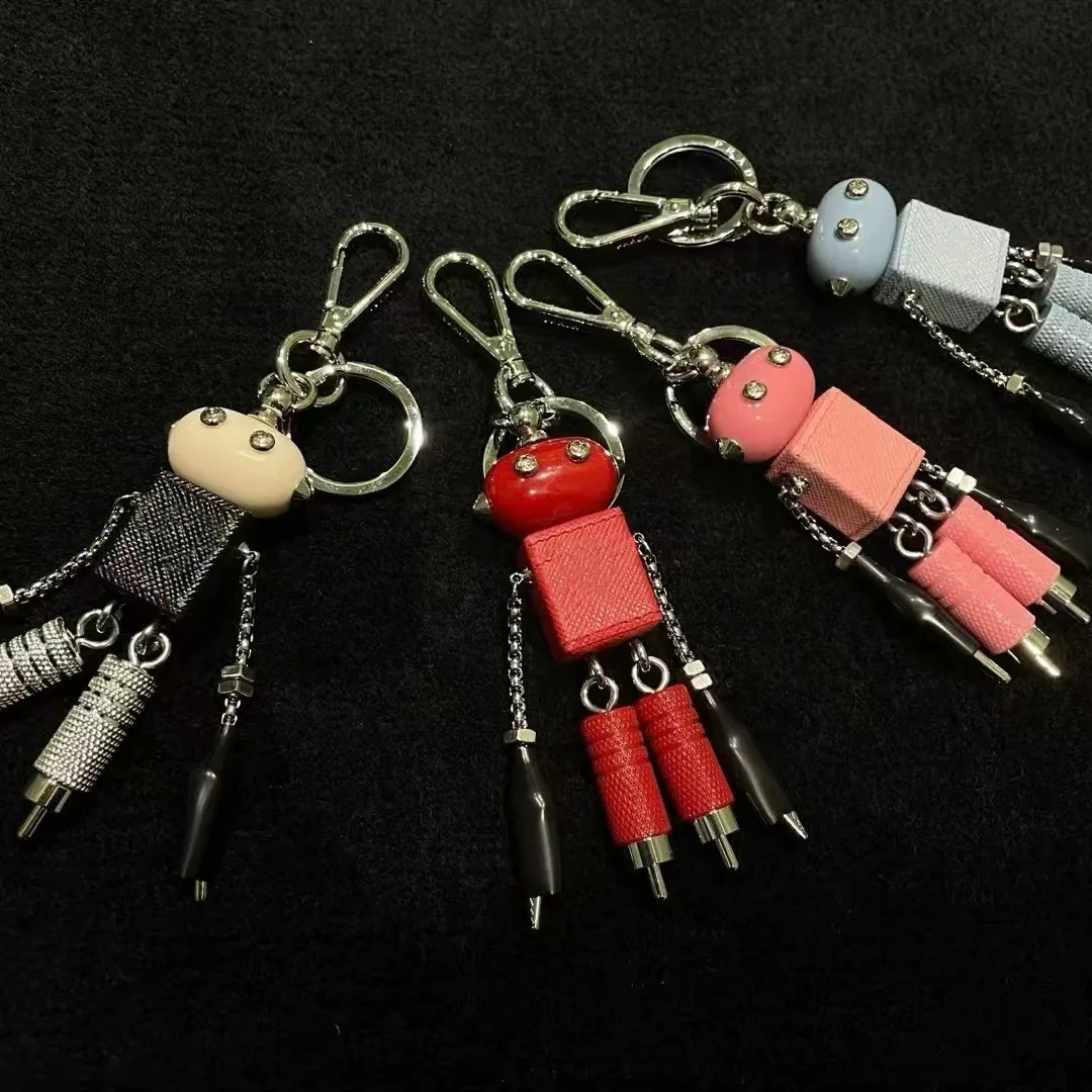 Robot pendant keychain leather bag hanging paired with artifact enamel triangle emblem hanging decoration250114