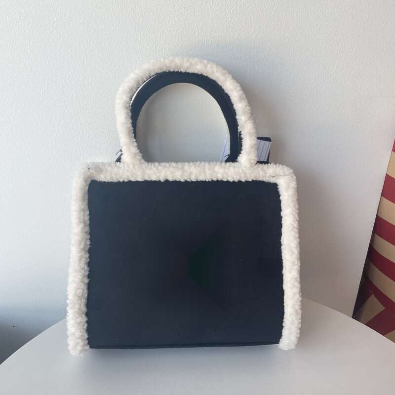 Autumn/Winter New Lamb Wool Plush Old Flower Letter Handheld Diagonal Cross Couple's Casual Commuter Tote Bag
