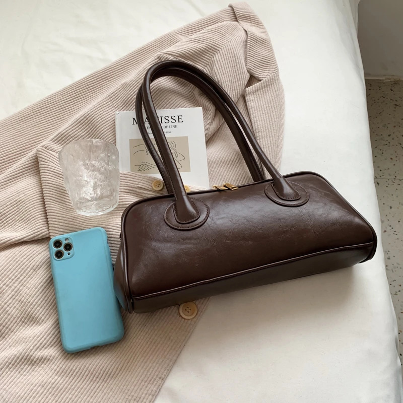 Solid color PU zipper stitched pillow shape fashionable shoulder bag retro handbag 2024 selling womens shoulder bag 250208