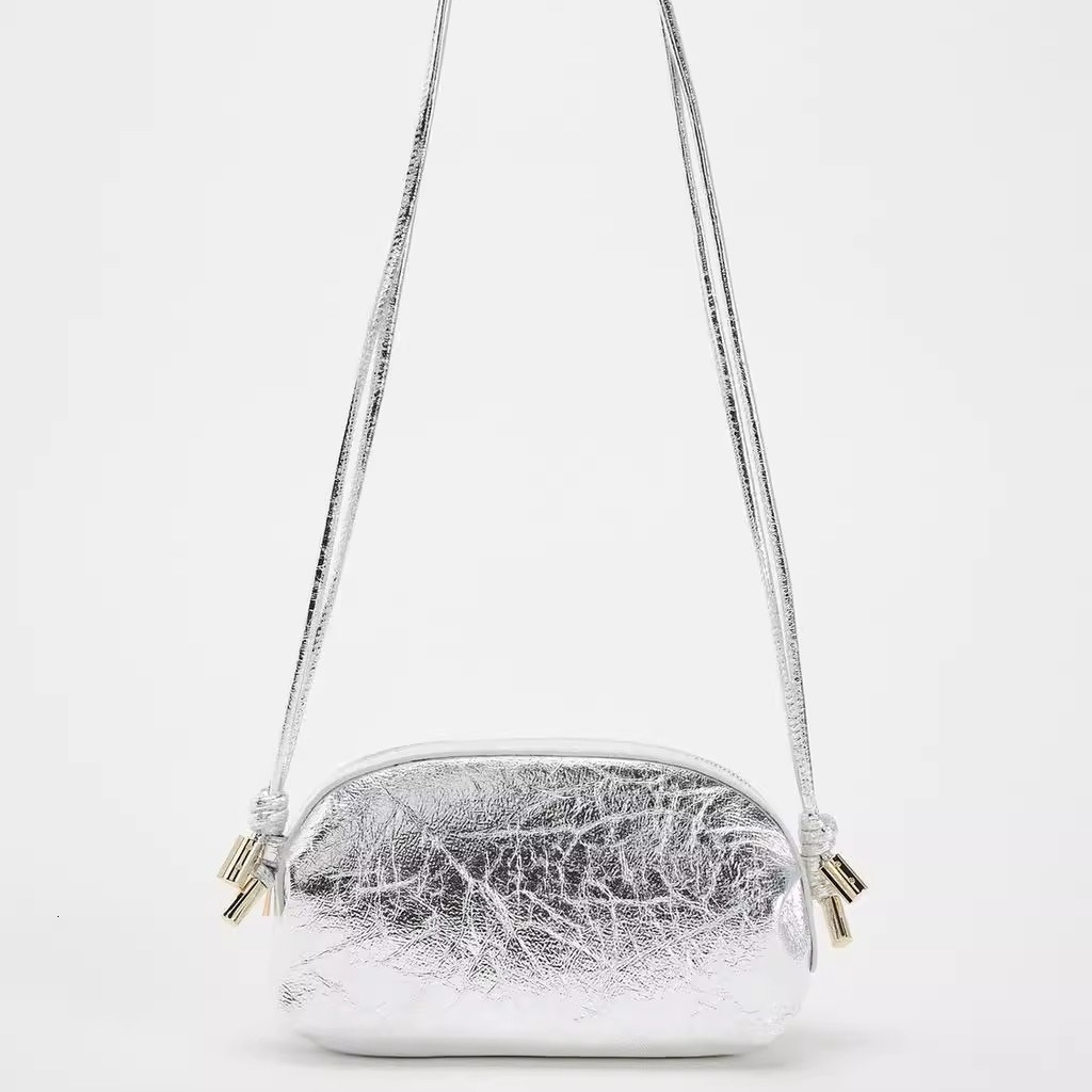designer bag 2024 New Silver Metal Oval Single Shoulder Fashion Crossover Small Bag for Women Commuting