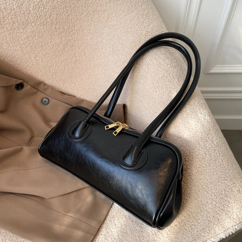 Solid color PU zipper stitched pillow shape fashionable shoulder bag retro handbag 2024 selling womens shoulder bag 250208