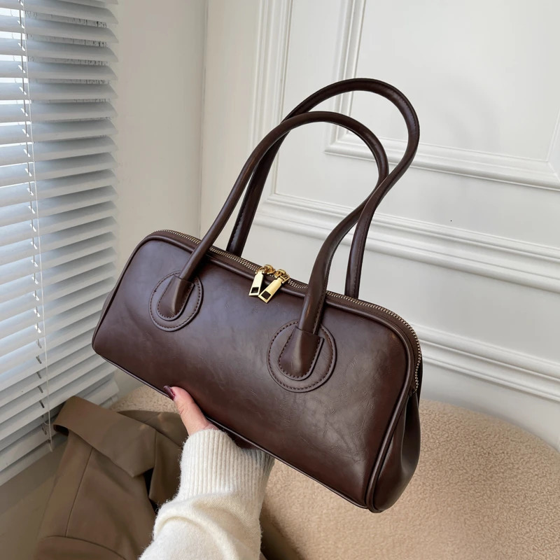 Solid color PU zipper stitched pillow shape fashionable shoulder bag retro handbag 2024 selling womens shoulder bag 250208