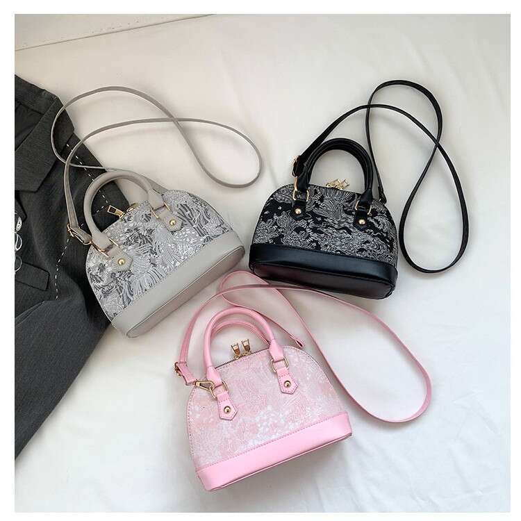Crossbody casual commuting hand-held shell bag, women's 2025 spring new style, simple and fashionable single shoulder