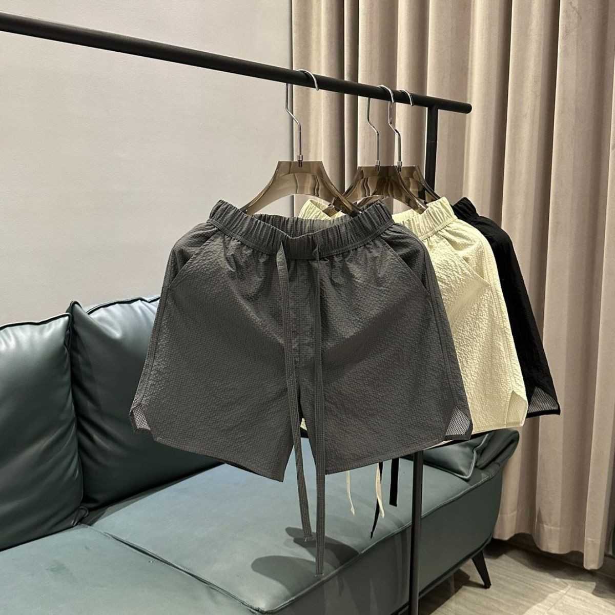 Summer new trend breathable quick drying casual shorts for men solid color simple and fashionable versatile loose Haren five quarter pants W250212