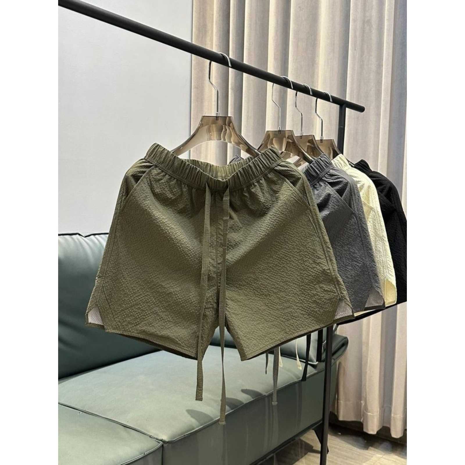 Summer new trend breathable quick drying casual shorts for men solid color simple and fashionable versatile loose Haren five quarter pants W250212