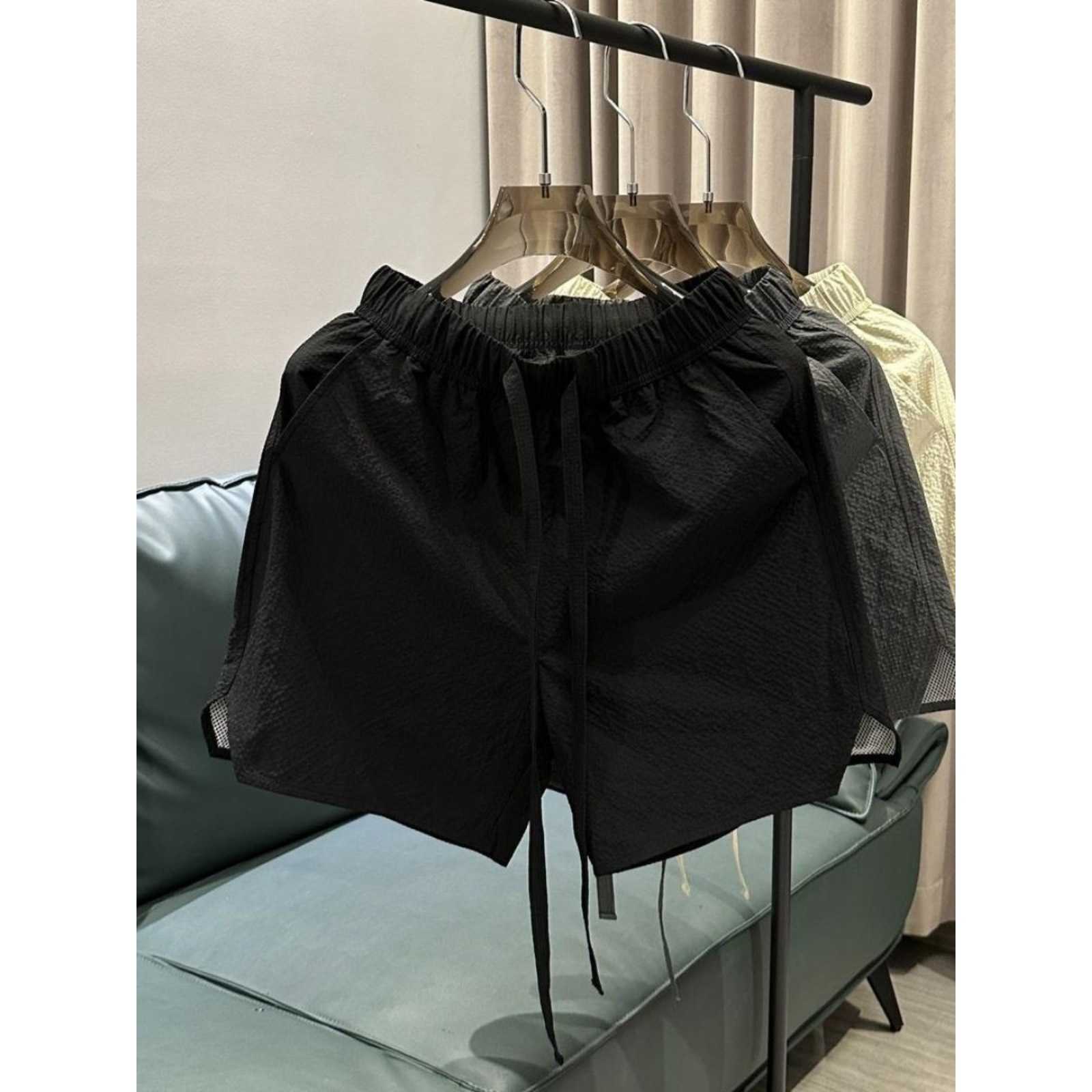 Summer new trend breathable quick drying casual shorts for men solid color simple and fashionable versatile loose Haren five quarter pants W250212
