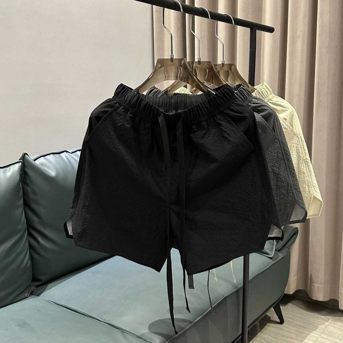 Summer new trend breathable quick drying casual shorts for men solid color simple and fashionable versatile loose Haren five quarter pants W250212