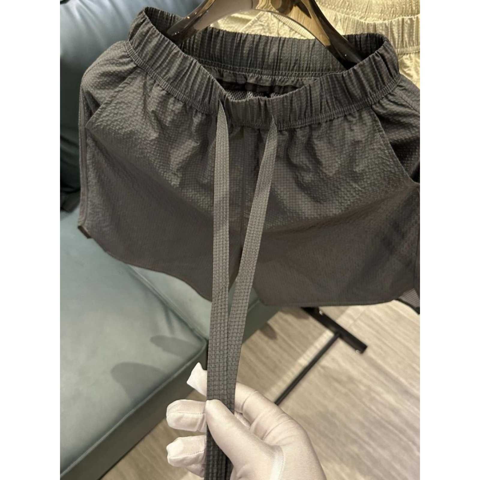 Summer new trend breathable quick drying casual shorts for men solid color simple and fashionable versatile loose Haren five quarter pants W250212