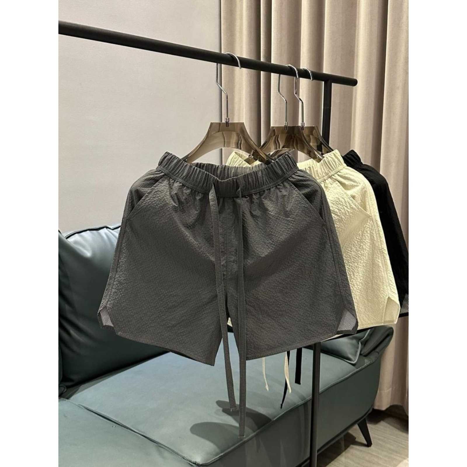 Summer new trend breathable quick drying casual shorts for men solid color simple and fashionable versatile loose Haren five quarter pants W250212