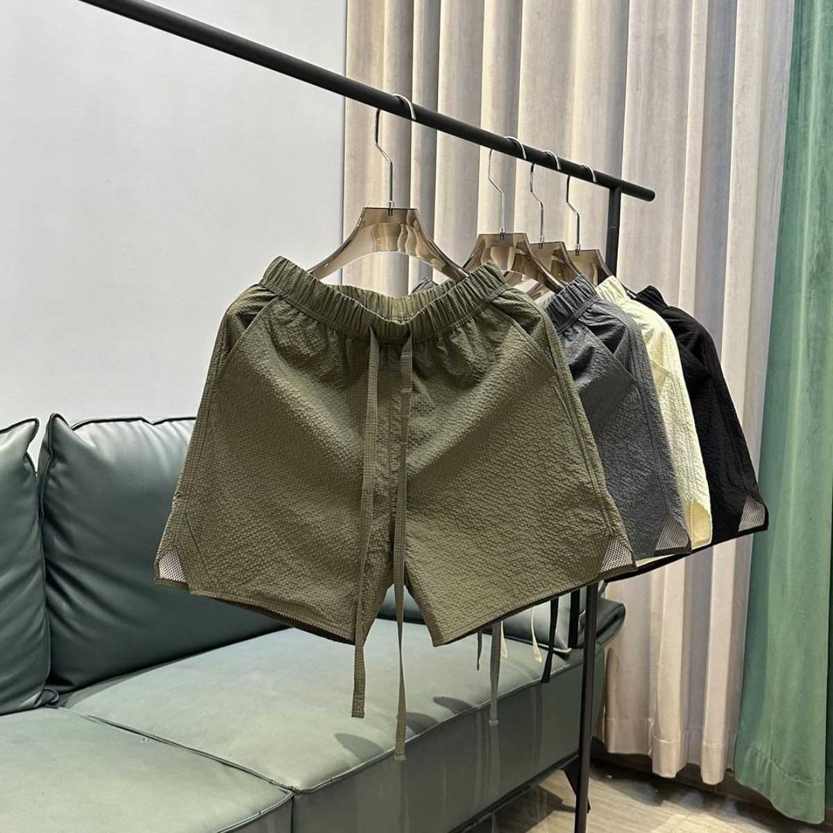 Summer new trend breathable quick drying casual shorts for men solid color simple and fashionable versatile loose Haren five quarter pants W250212
