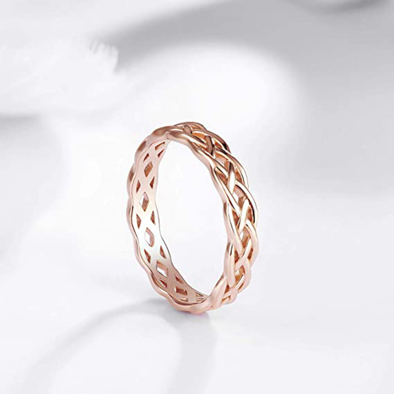 Europe and the United States fashion titanium steel jewelry minimalist weaving hollow wave effect Celtic knot couple ring love ring gold ring designer