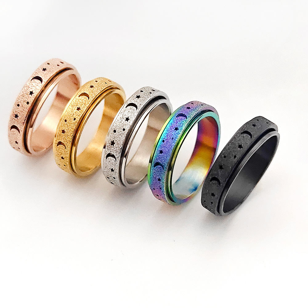 Frosted hollow stars and moon stainless steel rotatable stress relieving ring titanium steel finger ring female hand jewelry love ring gold ring desig