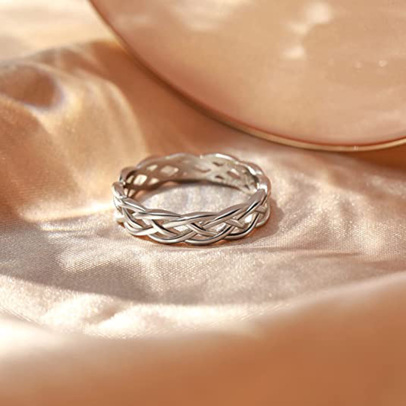 Europe and the United States fashion titanium steel jewelry minimalist weaving hollow wave effect Celtic knot couple ring love ring gold ring designer