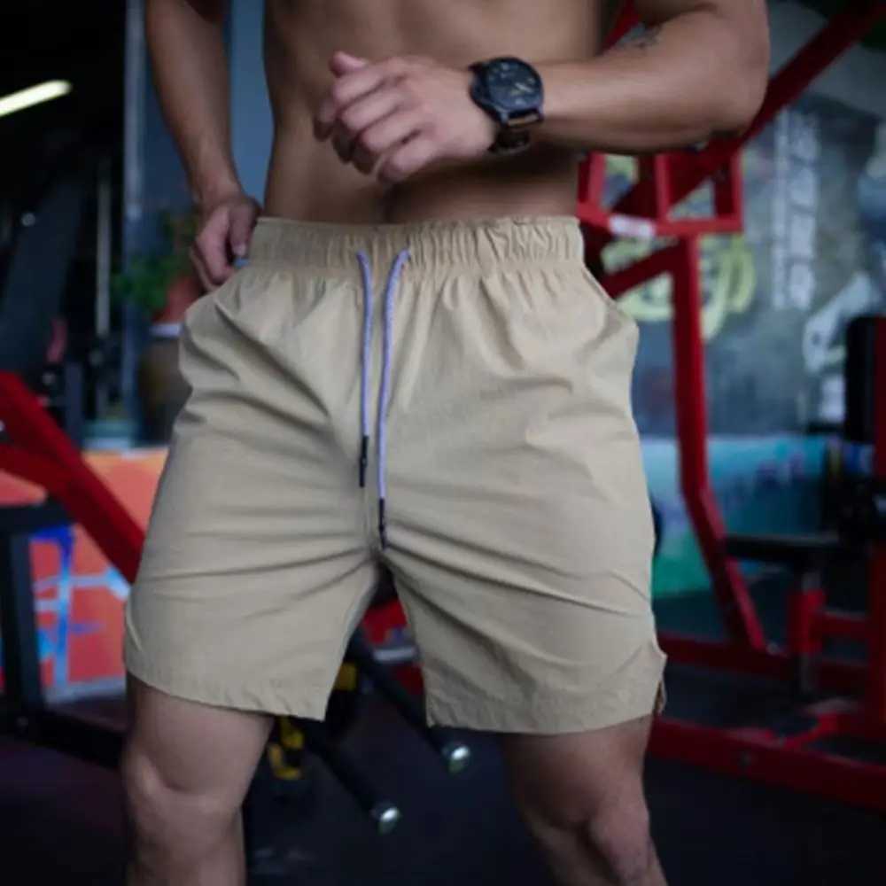 2024 new mens gym fitness loose shorts Fitness jogging pants summer quick dry cool shorts mens casual beach brand sports pantsXJ250213