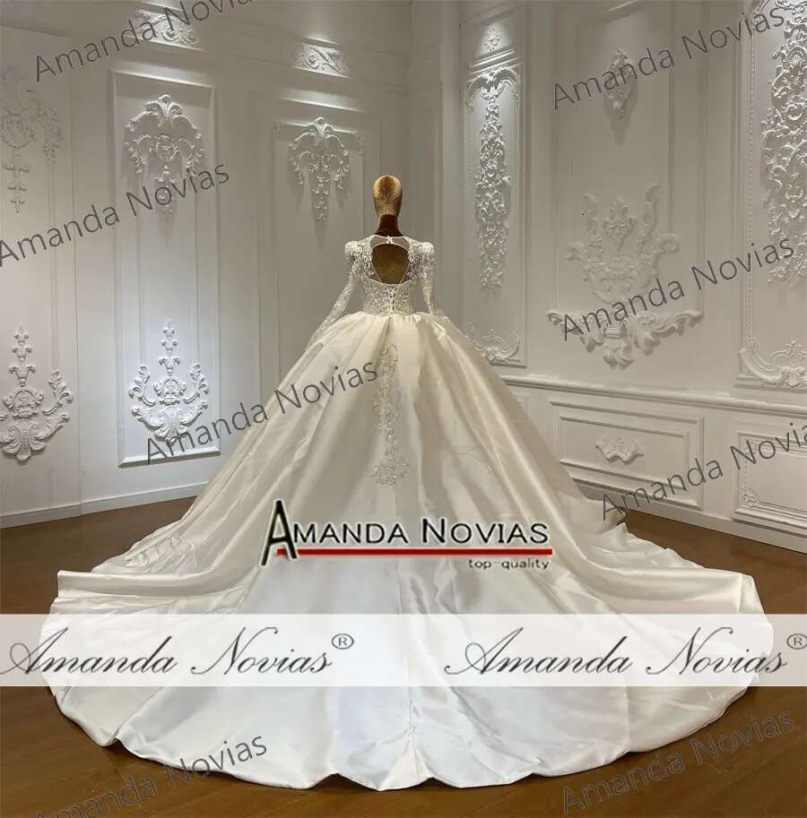 Custom wedding dress with V-neckline and lace beads