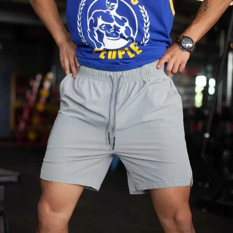 2024 new mens gym fitness loose shorts Fitness jogging pants summer quick dry cool shorts mens casual beach brand sports pantsXJ250213