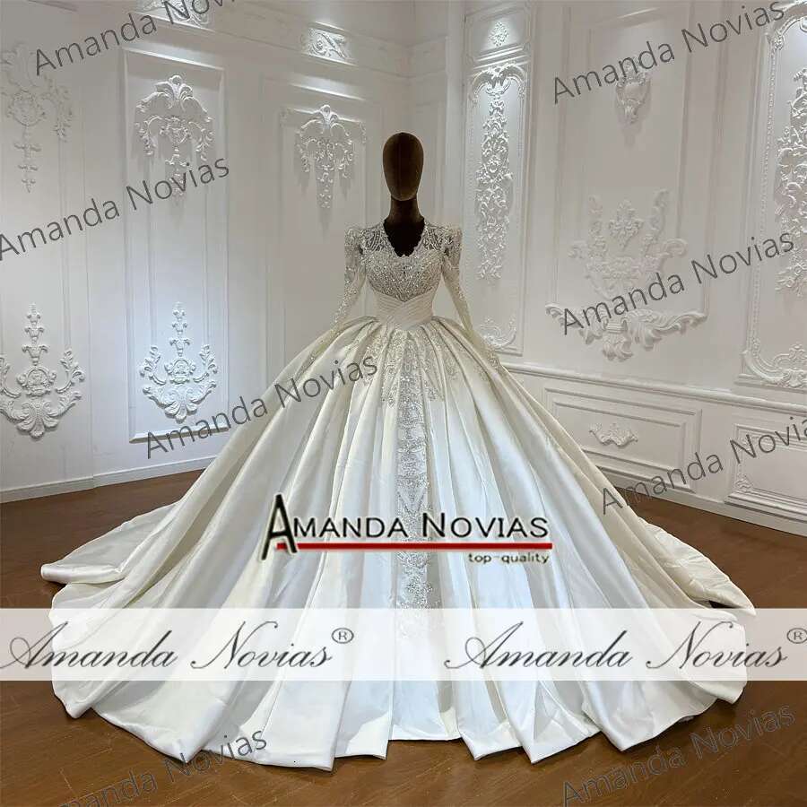 Custom wedding dress with V-neckline and lace beads