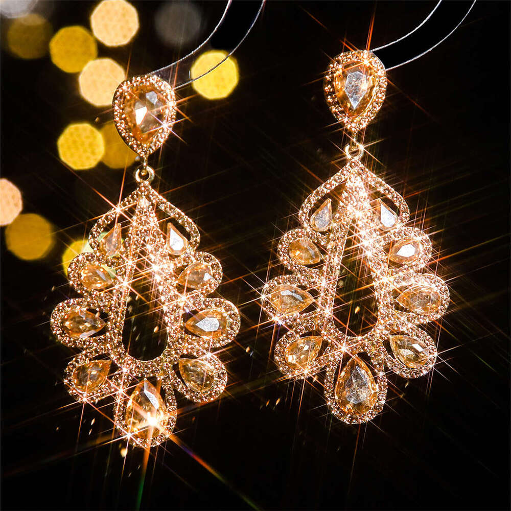 Fashionable shiny glass rhie long water droplet feminine temperament earrings, elegant and trendy earrings