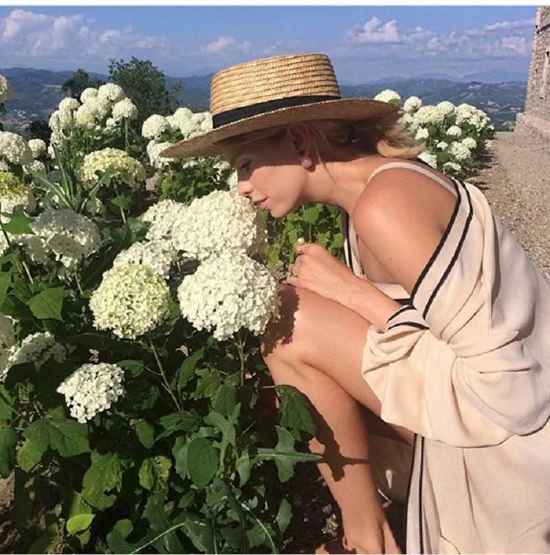 Summer unisex handmade natural wheat straw hat womens sun hat with bow wide eaves flat top hat mens beach solid hat sunscreen A1 Y250213