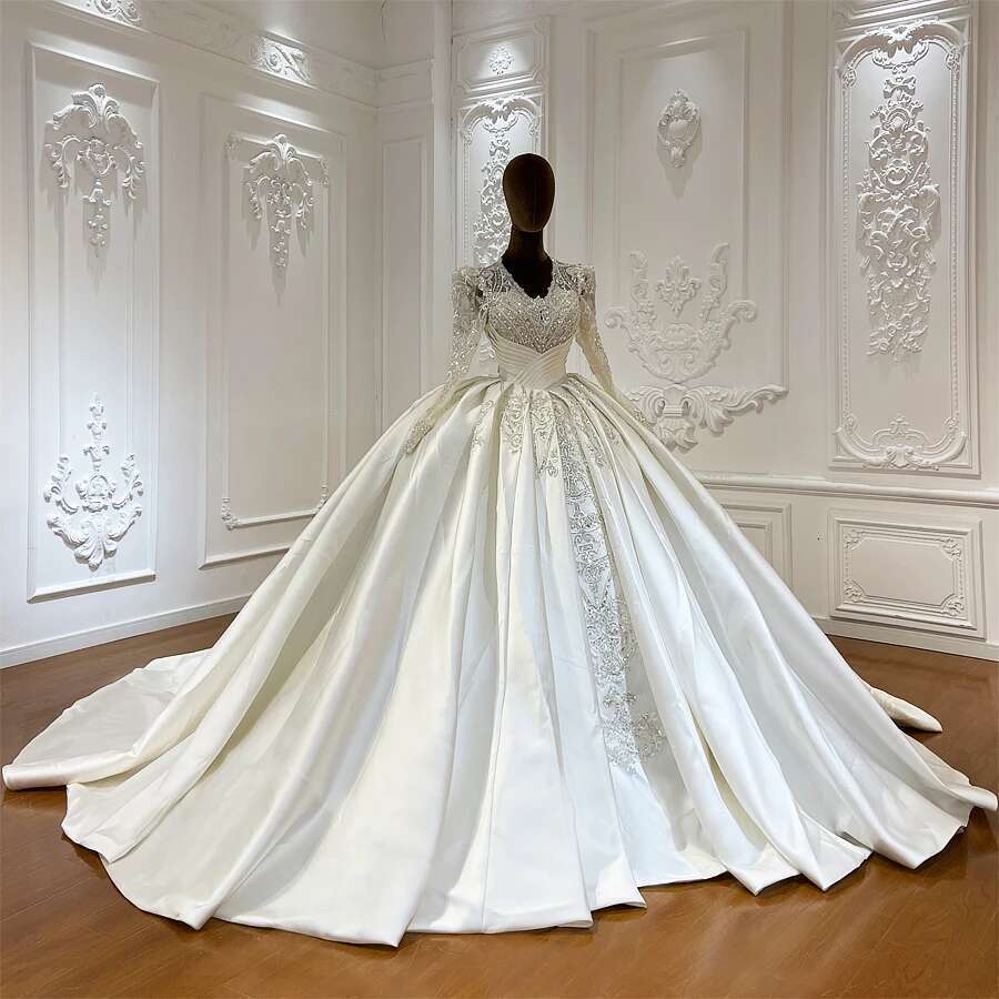 Custom wedding dress with V-neckline and lace beads